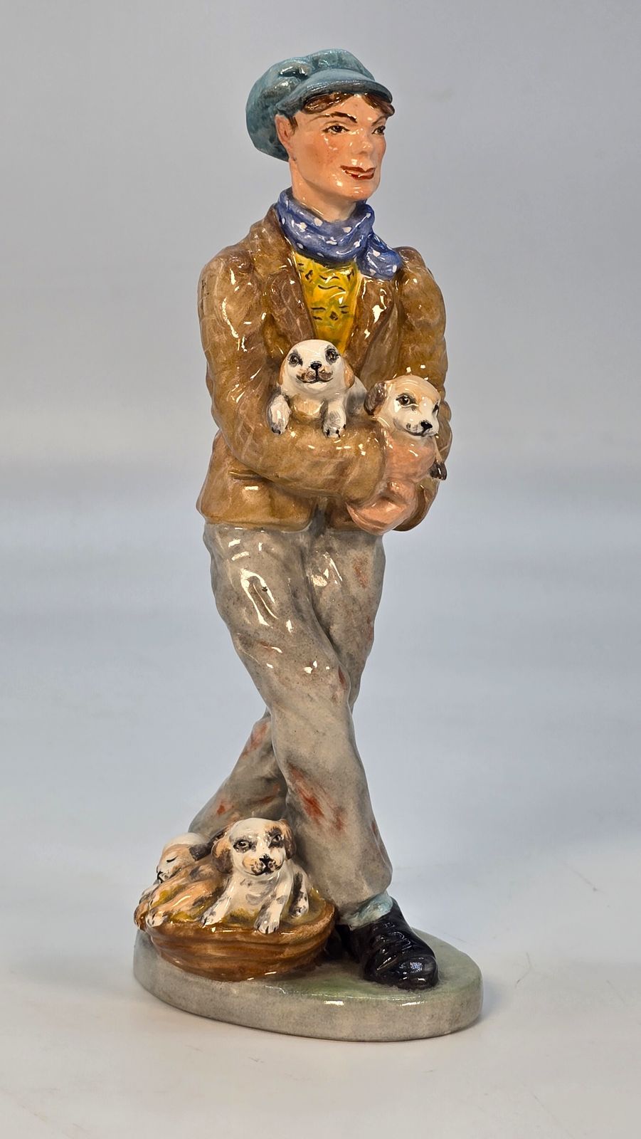 A Rare Edwardian Wedgwood & Co. Ltd China Figure Of The Puppy Seller.