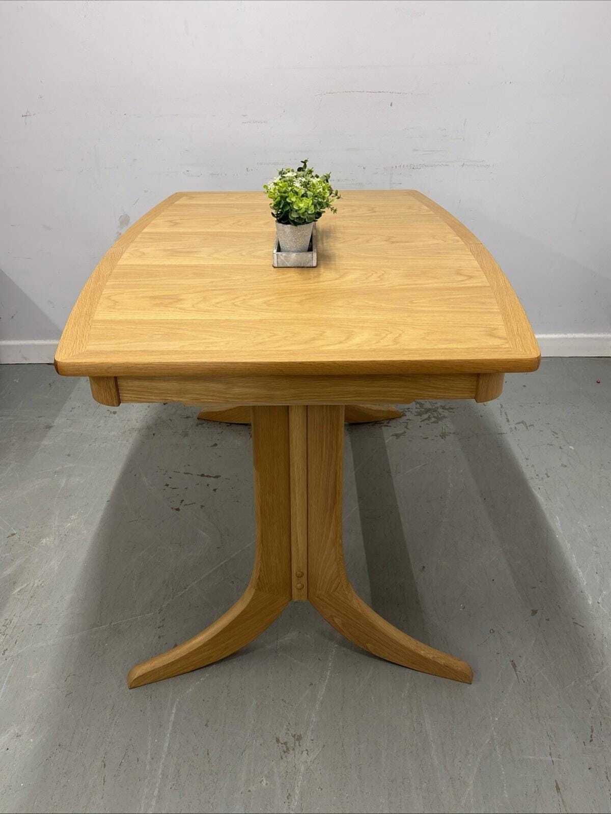 Nathan Shades Boat Shaped Extending Dining Table – Oak Finish