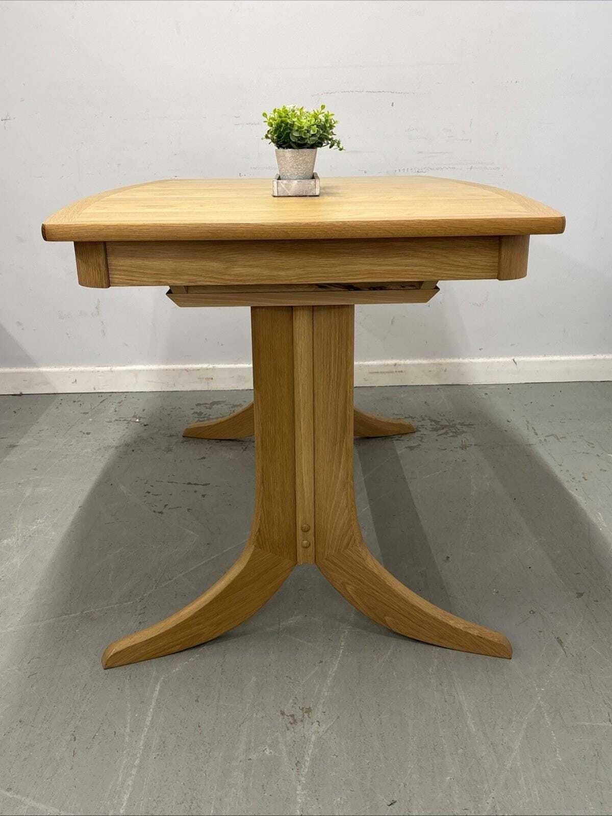 Nathan Shades Boat Shaped Extending Dining Table – Oak Finish photo for sale