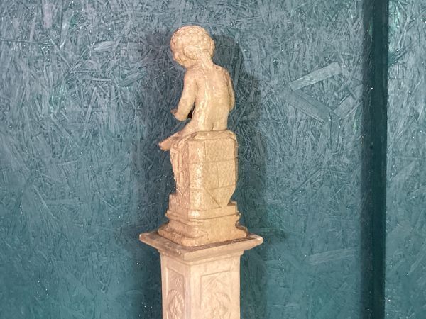 A Fine Petite Stoneware Sculpture Of A Seated Cherub photo for sale