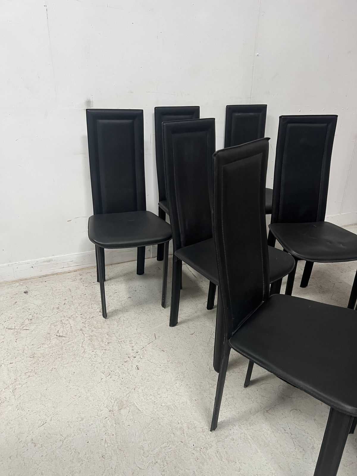 Set Of Eight Designer Chairs In Black Leather From The 20th Century photo for sale
