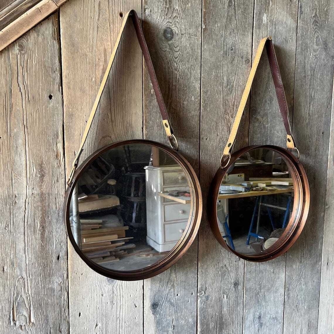 A Pair Of Wall Hanging Circular Metal Framed Mirror With Hanging Strap photo Art