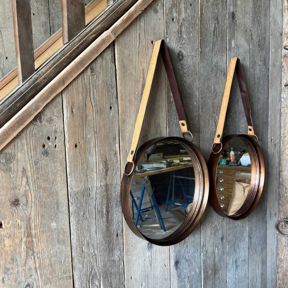 A Pair Of Wall Hanging Circular Metal Framed Mirror With Hanging Strap photo vinterior