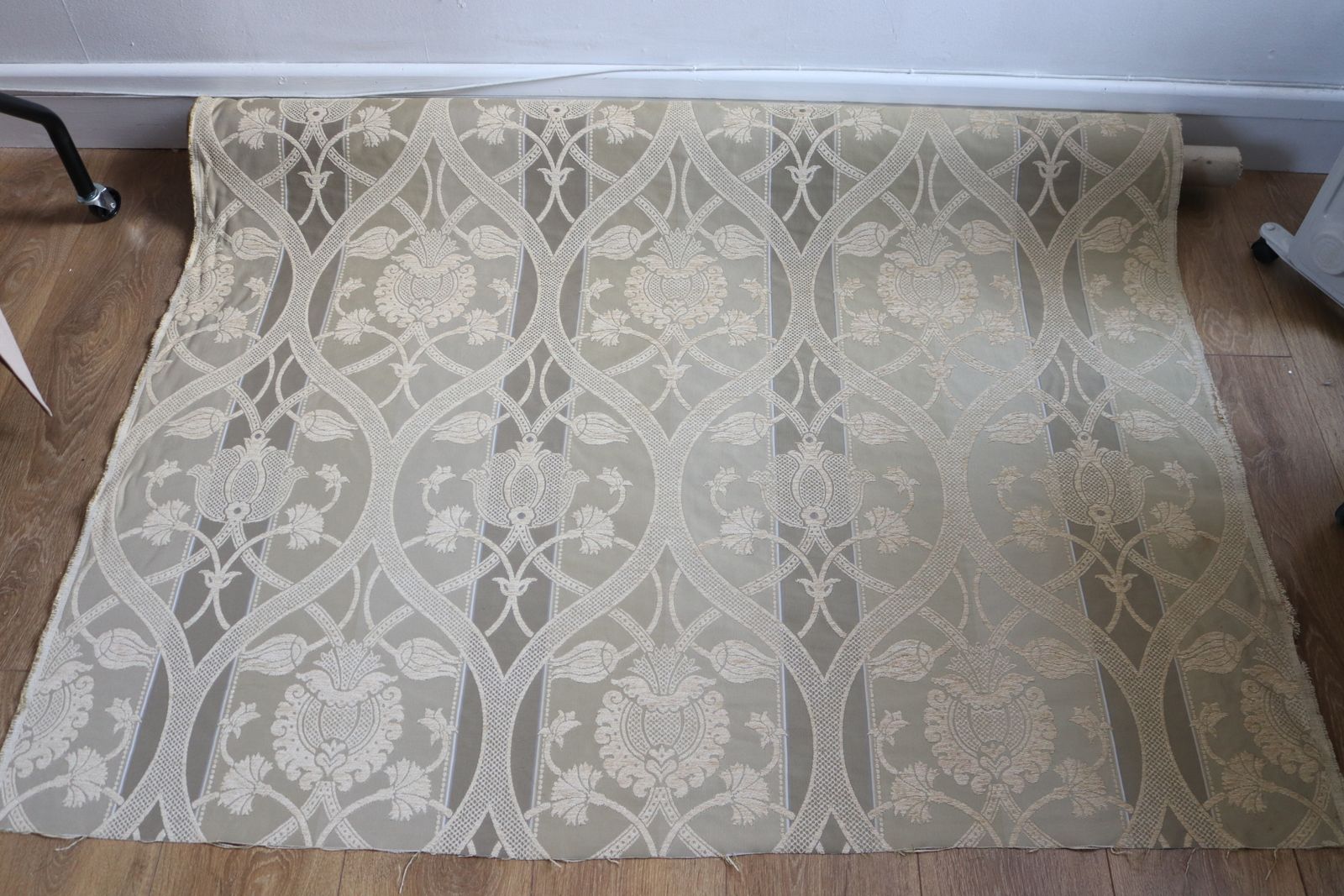 Roll Of Gold Fabric With A Decorative Design