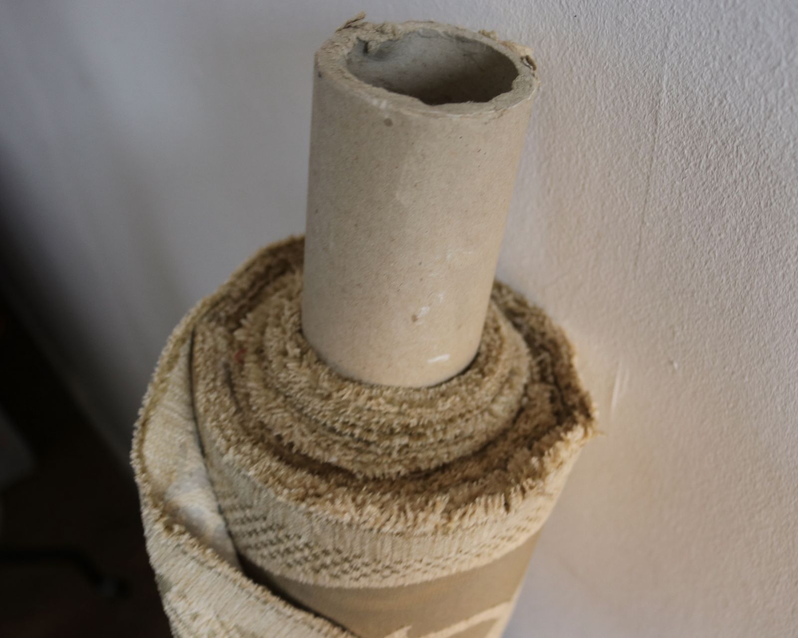 Roll Of Gold Fabric With A Decorative Design photo vinterior