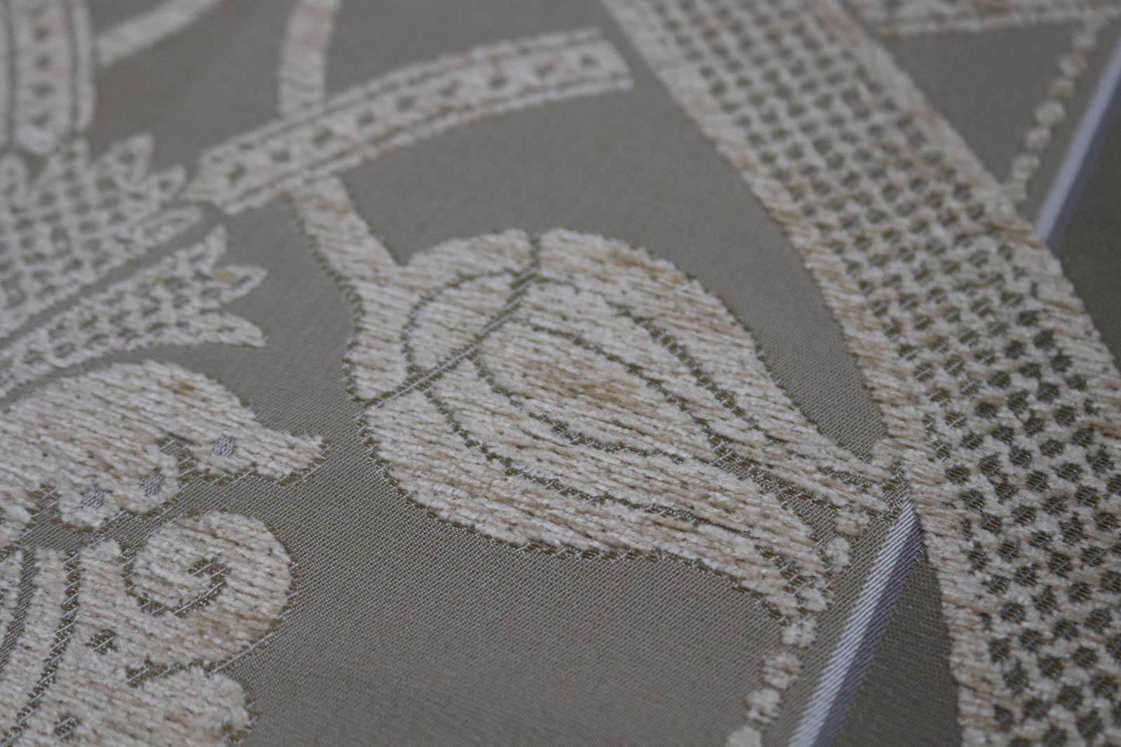 Roll Of Gold Fabric With A Decorative Design photo buy