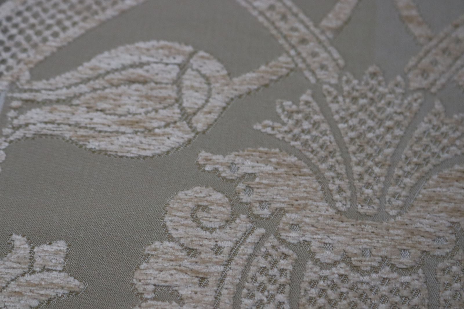 Roll Of Gold Fabric With A Decorative Design photo vintage
