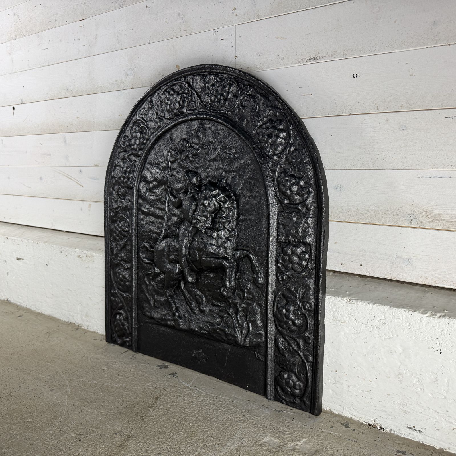 Antique Cast Iron Fire Back Depicting A Soldier On Horseback photo for sale