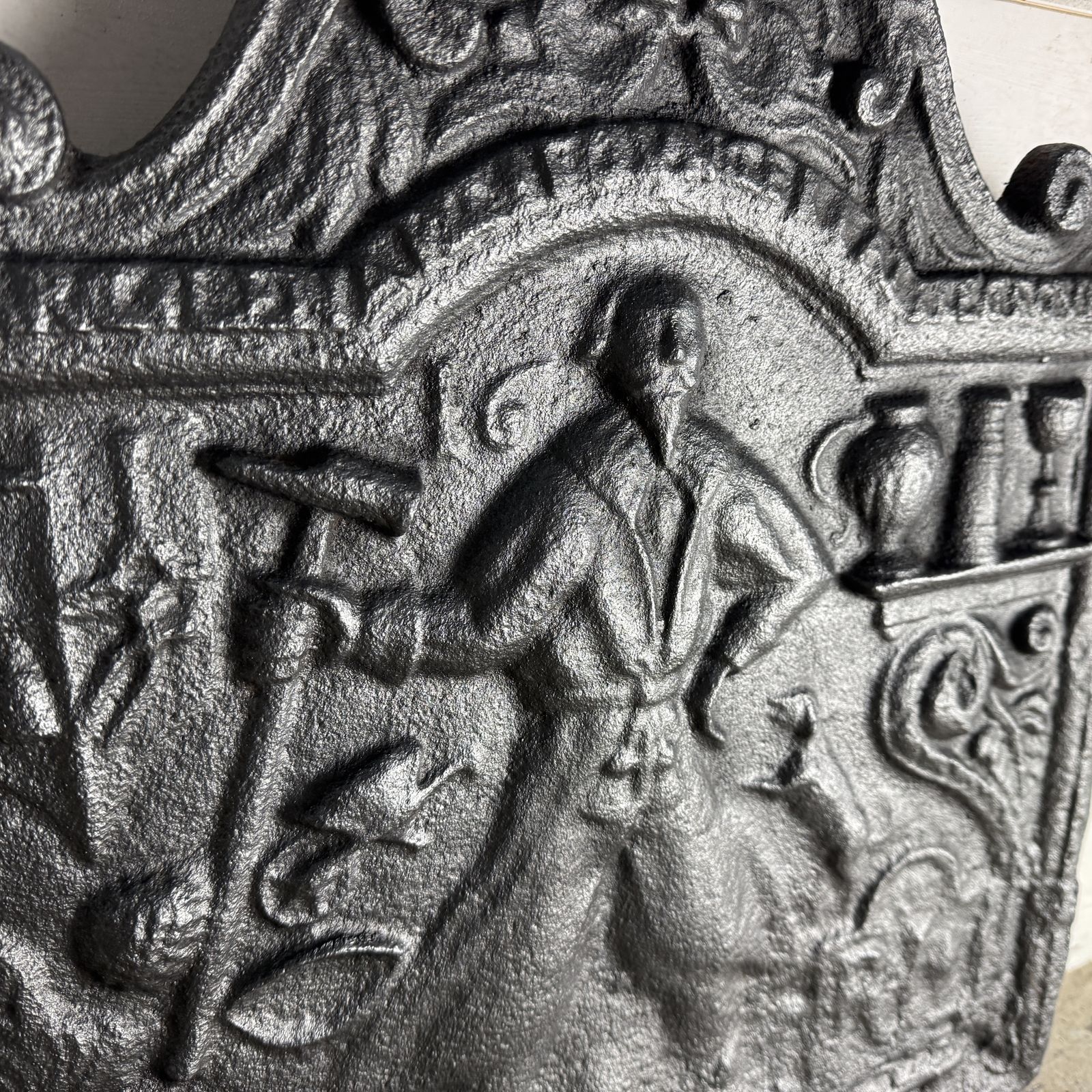 Antique Cast Iron Fire Back Depicting A Blacksmith photo vinterior