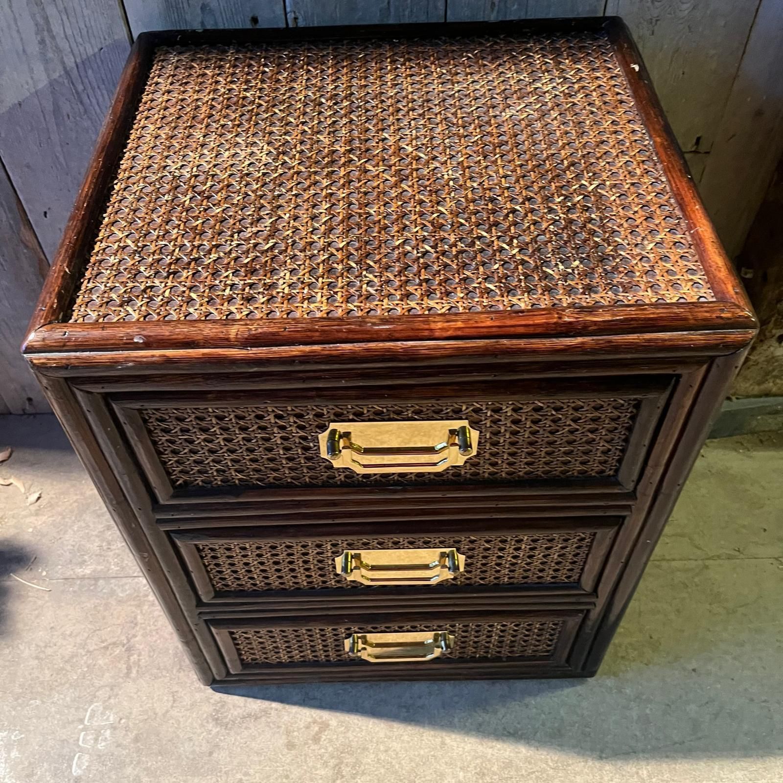 A Dark Cane Covered Bedside Cabinet With 3 Drawers And Brass Handles photo for sale