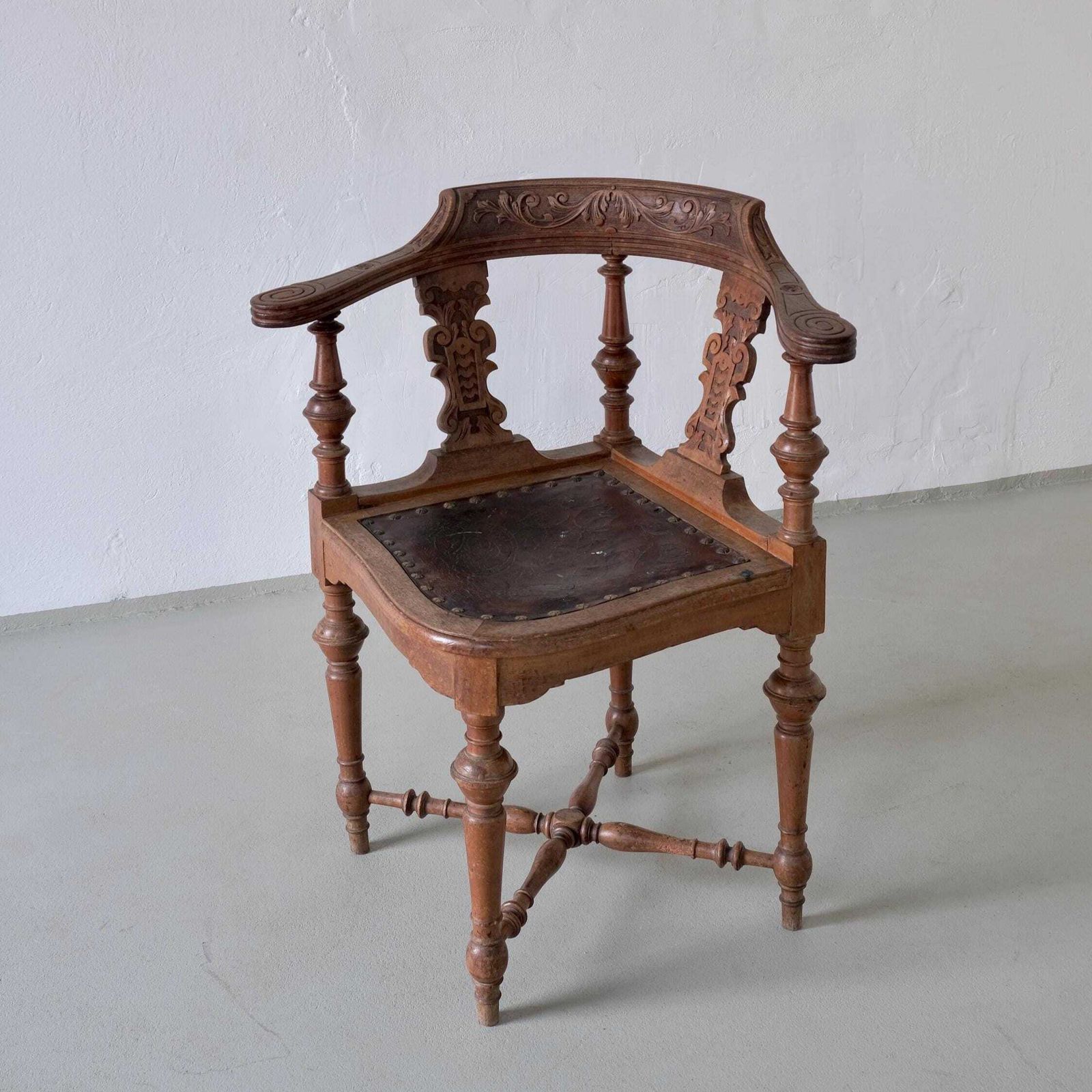 Antique Carved Corner Chair With Leather Seat