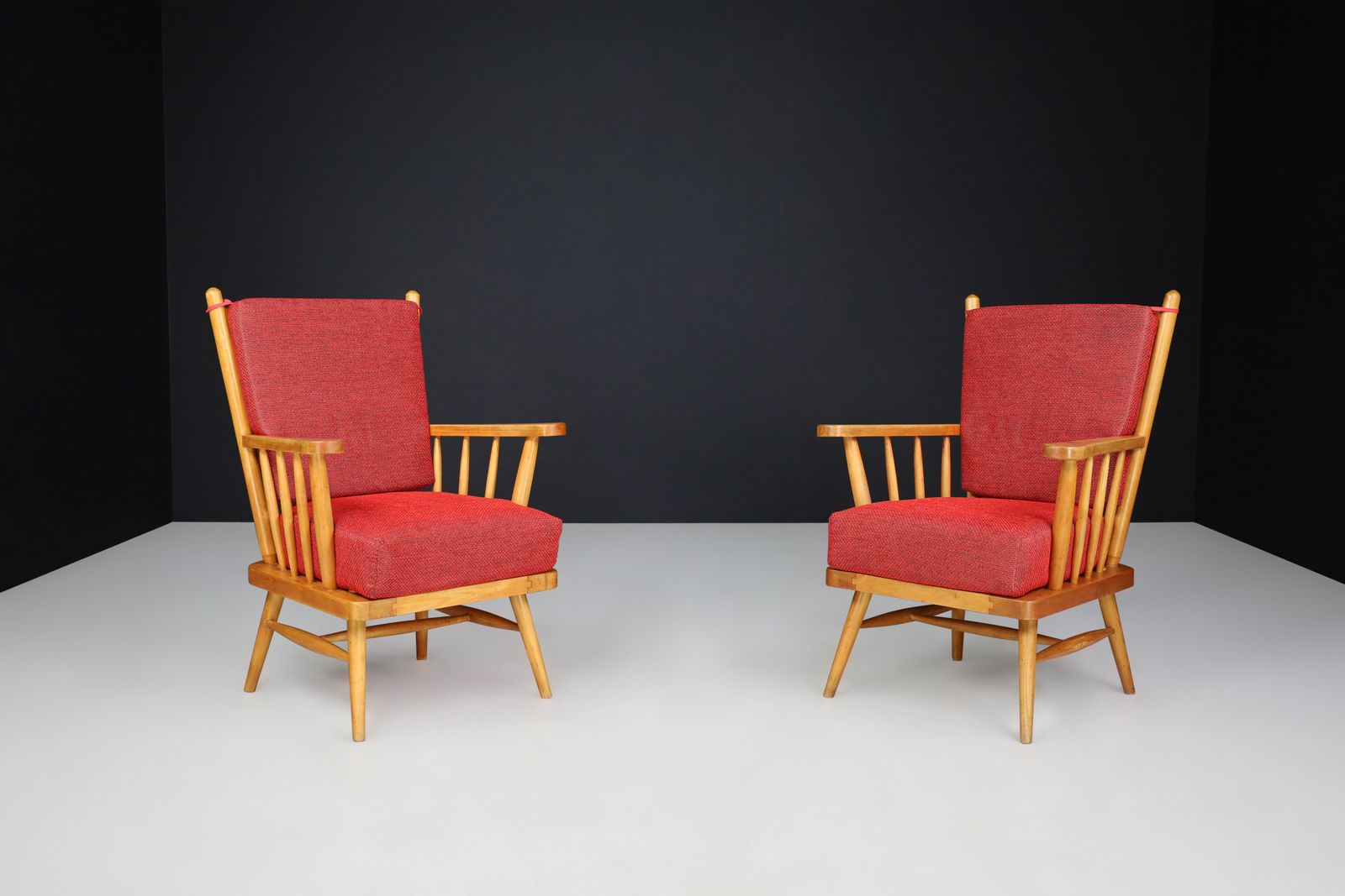 photo furniture Pair Of Scandinavian Mid Century Modern Lounge Chairs In Beech & Red Upholstery.