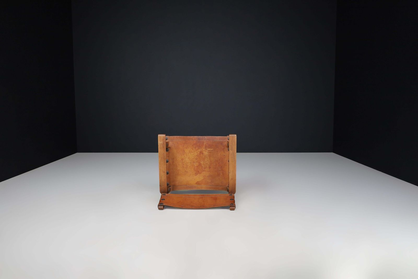 photo furniture Patinated Wood And Cognac Leather "Spanish Chair" Spain, 1960s