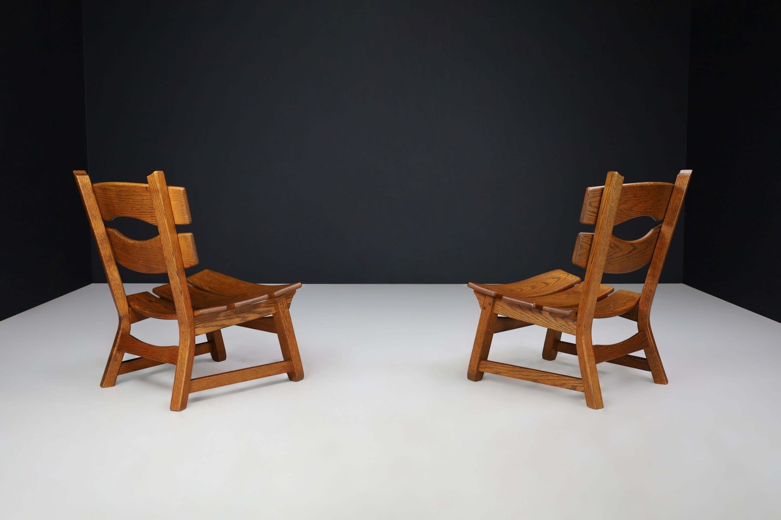 photo furniture Pair Of Sculptural Brutalist Oak Lounge Chairs, France, 1960s