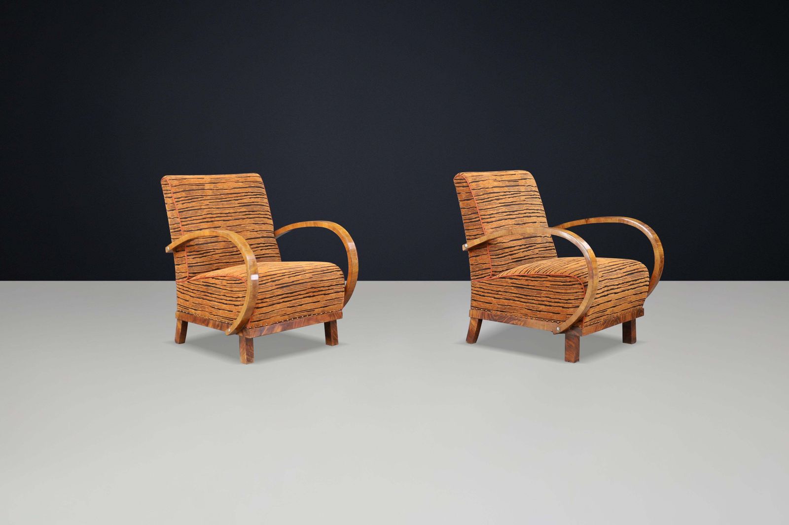 photo furniture Striking Pair Of Austrian Art Deco Lounge Chairs In Walnut With New Tiger Fabric