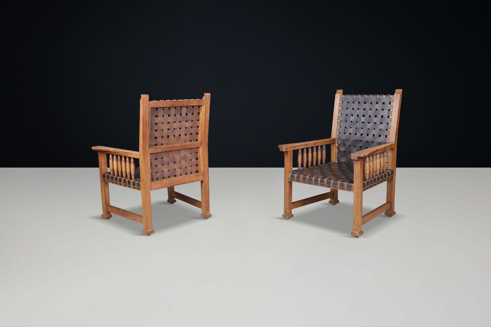 photo furniture A Pair Of Leather And Oak Armchairs From France, 1950s.