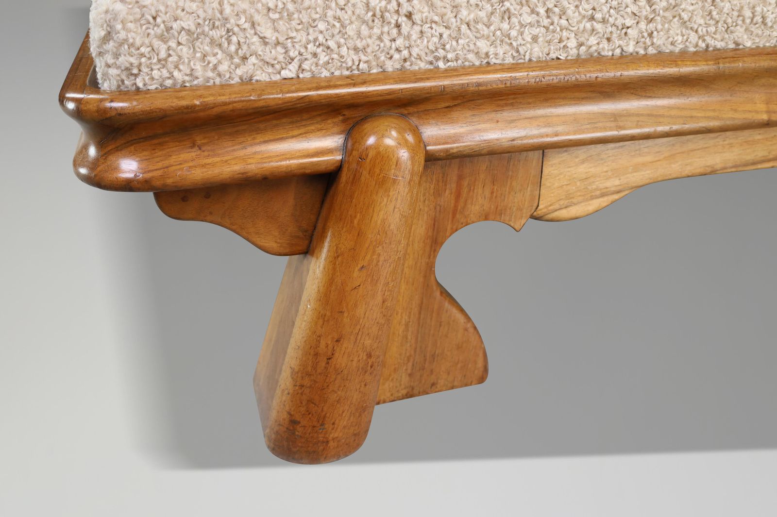 photo furniture Monumental French Brutalist Walnut Daybed, Sculptural With Bouclé Upholstery.