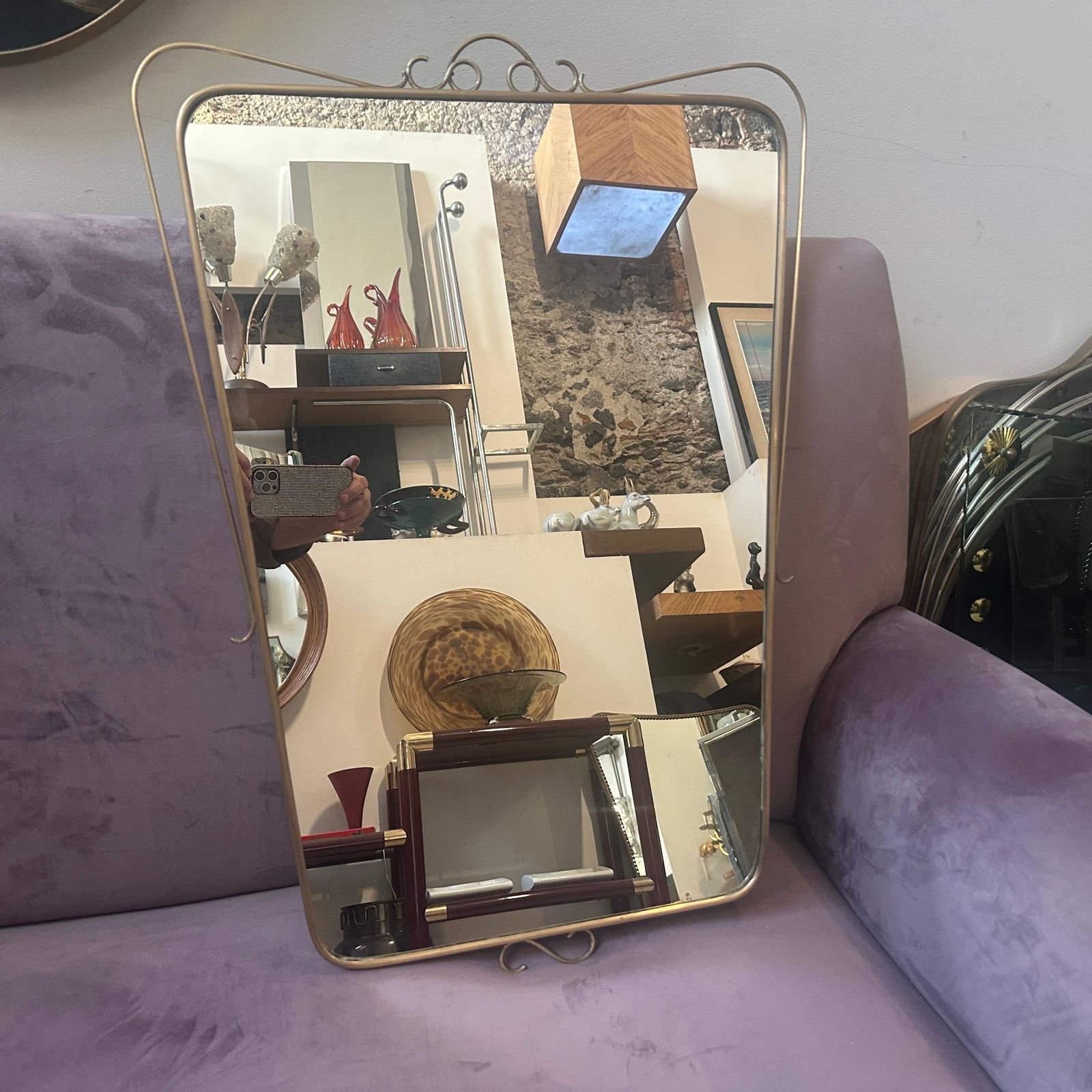 1659.0 A 1950s Mid Century Modern Brass Italian Wall Mirror In The Manner Of Gio Ponti photo