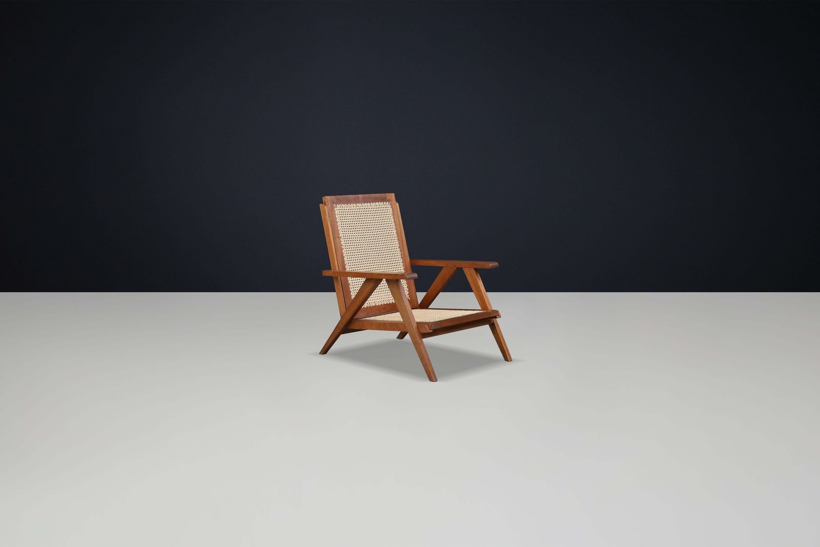 photo for sale 1950s French Teak And Cane Armchairs – Mid Century Modern Icons