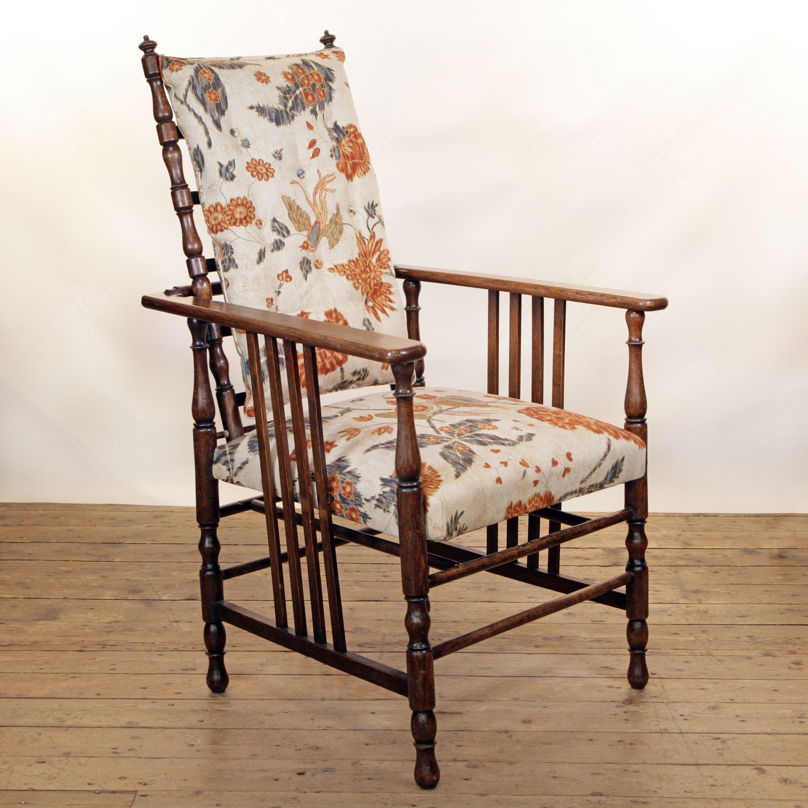 An Arts & Crafts Oak Reclining Armchair Retailed By Shapland And Petter And Wylie & Lochhead