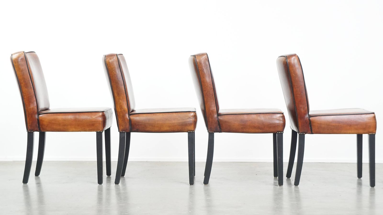 Luxurious Set Of 4 Comfortable Dining Chairs Made Of Sheepskin Finished With Black Piping photo for sale