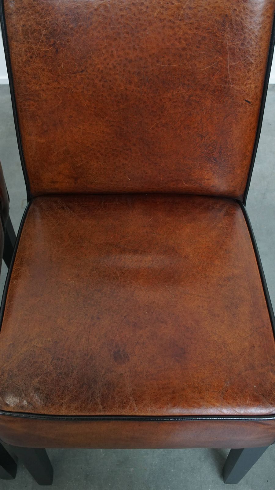 photo furniture Luxurious Set Of 4 Comfortable Dining Chairs Made Of Sheepskin Finished With Black Piping