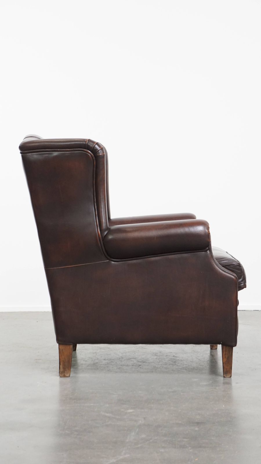 Very Beautiful And Comfortable Wing Chair Made Of Cowhide In English Style photo for sale