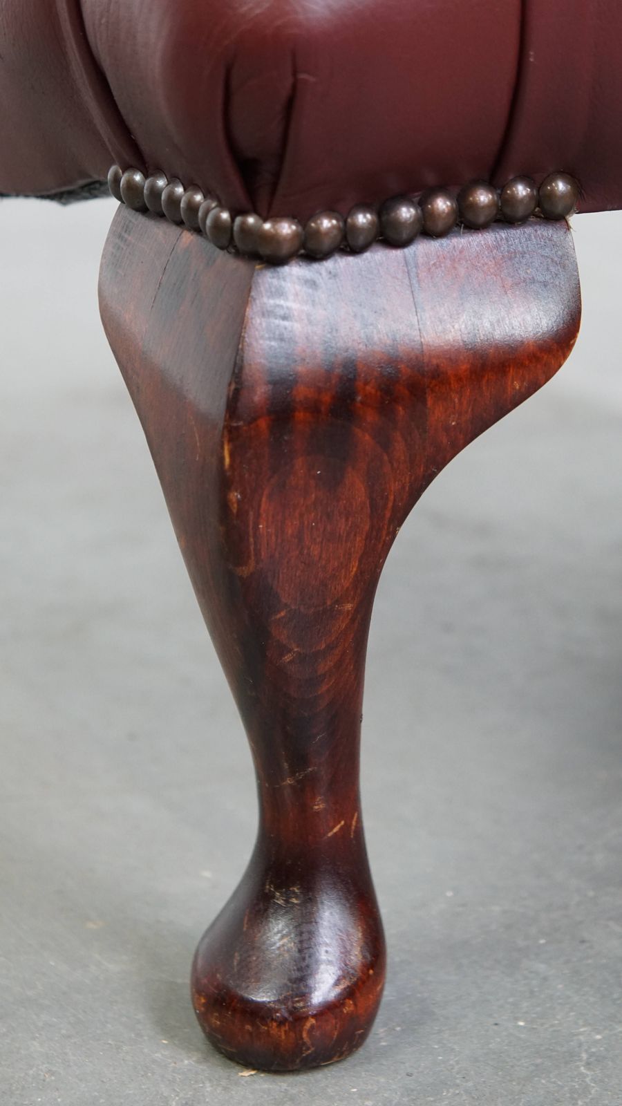photo for sale Elegant Red/Brown Chesterfield Stool Made Of Cowhide In Very Good Condition