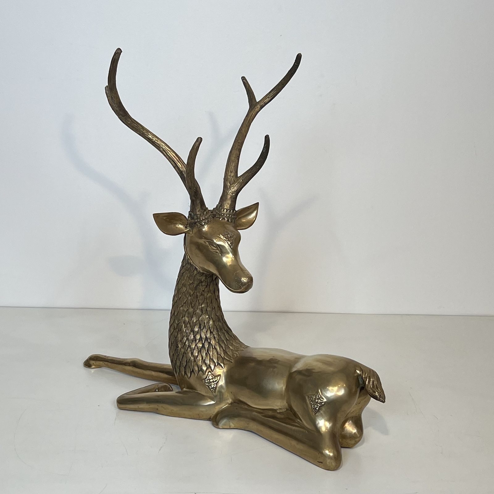 Important Bronze Stag Reclining Engraved With Shamanic Motifs photo for sale