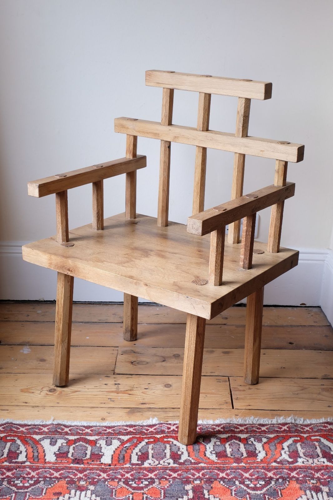photo furniture Primitive Handmade Wooden Armchair In Rustic Timber Finish