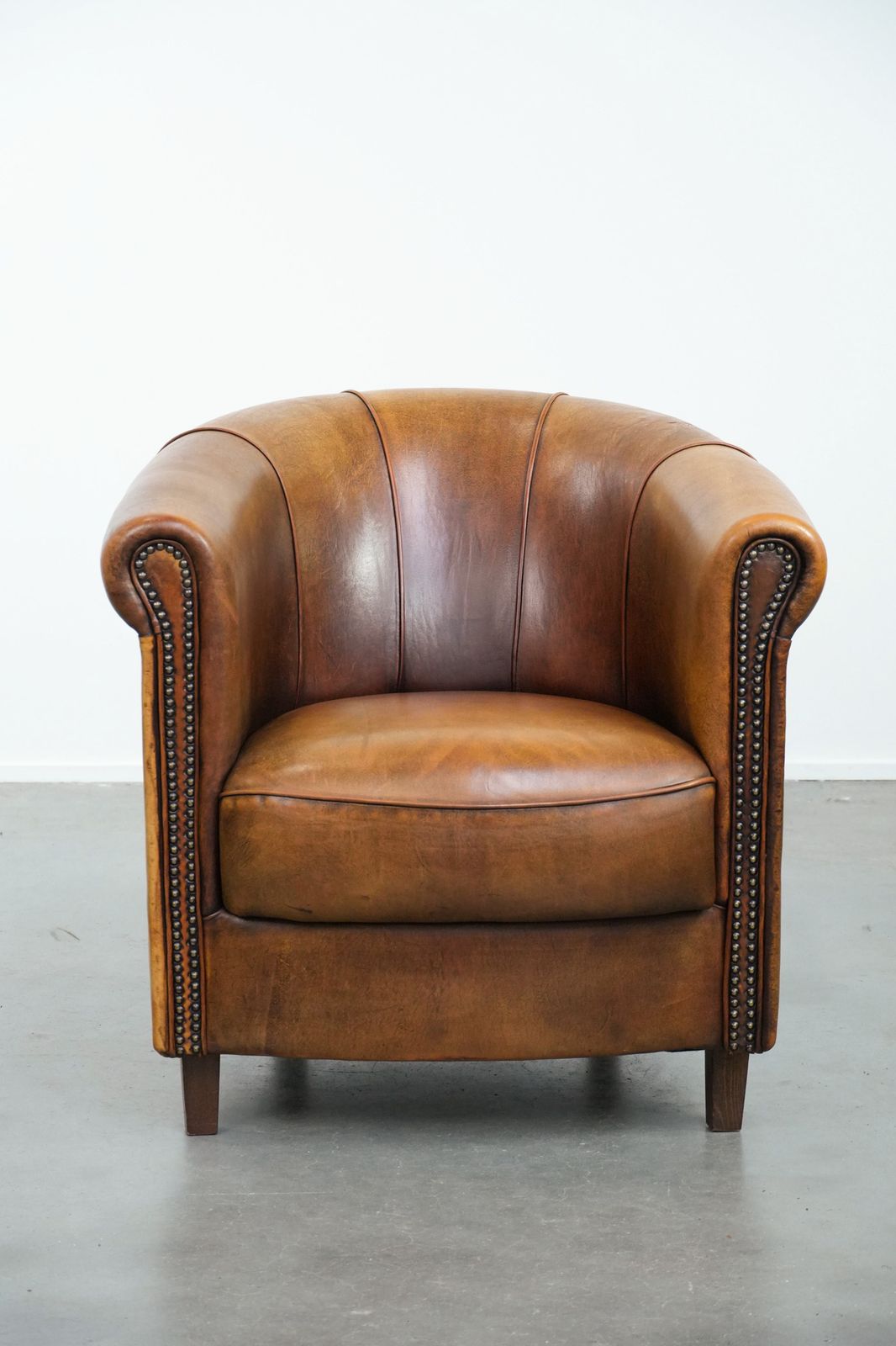 Elegant Sheepskin Club Armchair With Beautiful Warm Colours, A Finish With Decorative Nails And Beautiful Stitching photo furniture