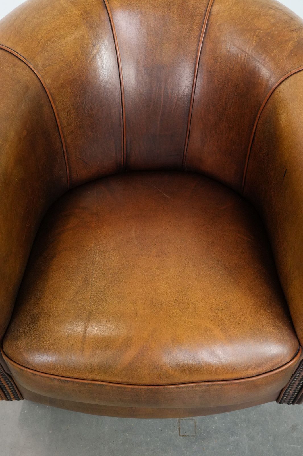 Elegant Sheepskin Club Armchair With Beautiful Warm Colours, A Finish With Decorative Nails And Beautiful Stitching photo vinterior