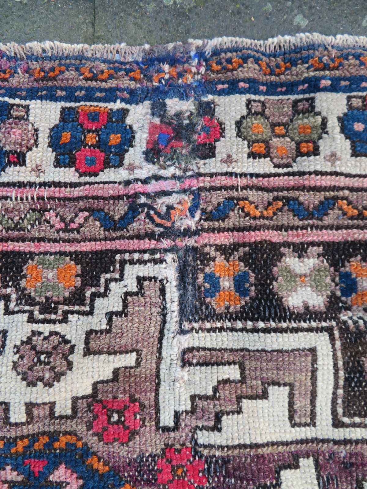 photo furniture Distressed Caucasian Lesghi Rug. 140cm X 100cm.