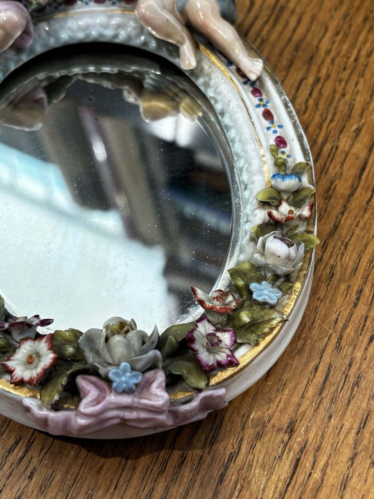 photo furniture Pair Of Small Winged Cherub Porcelain Wall Mirrors, German, Possibly Meissen