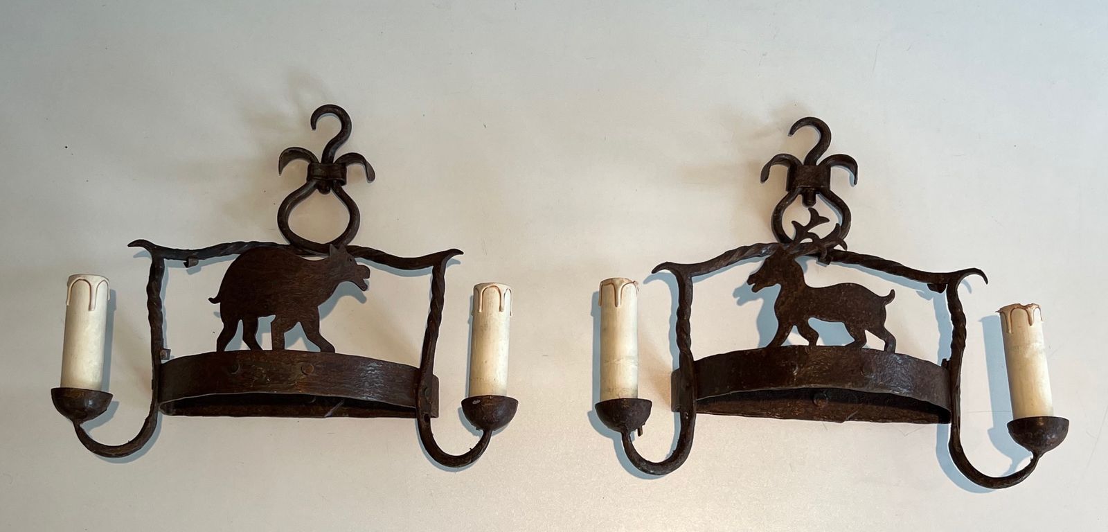 1250.0 Pair Of Wrought Iron Wall Sconces Depicting Animals photo