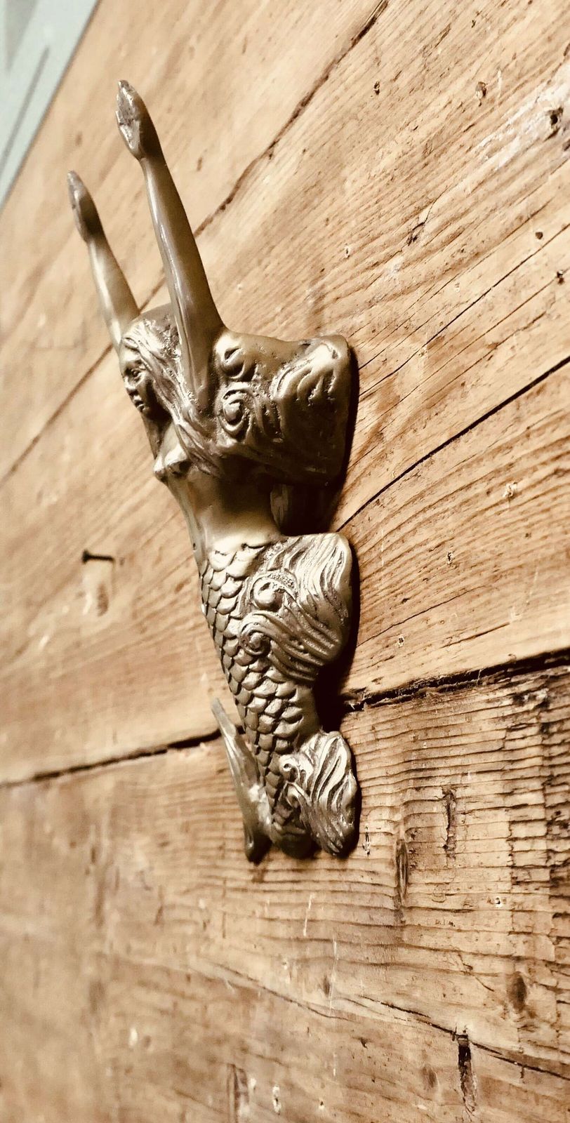 A Brass Door Knocker In The Shape Of A Mermaid photo Home Fixtures
