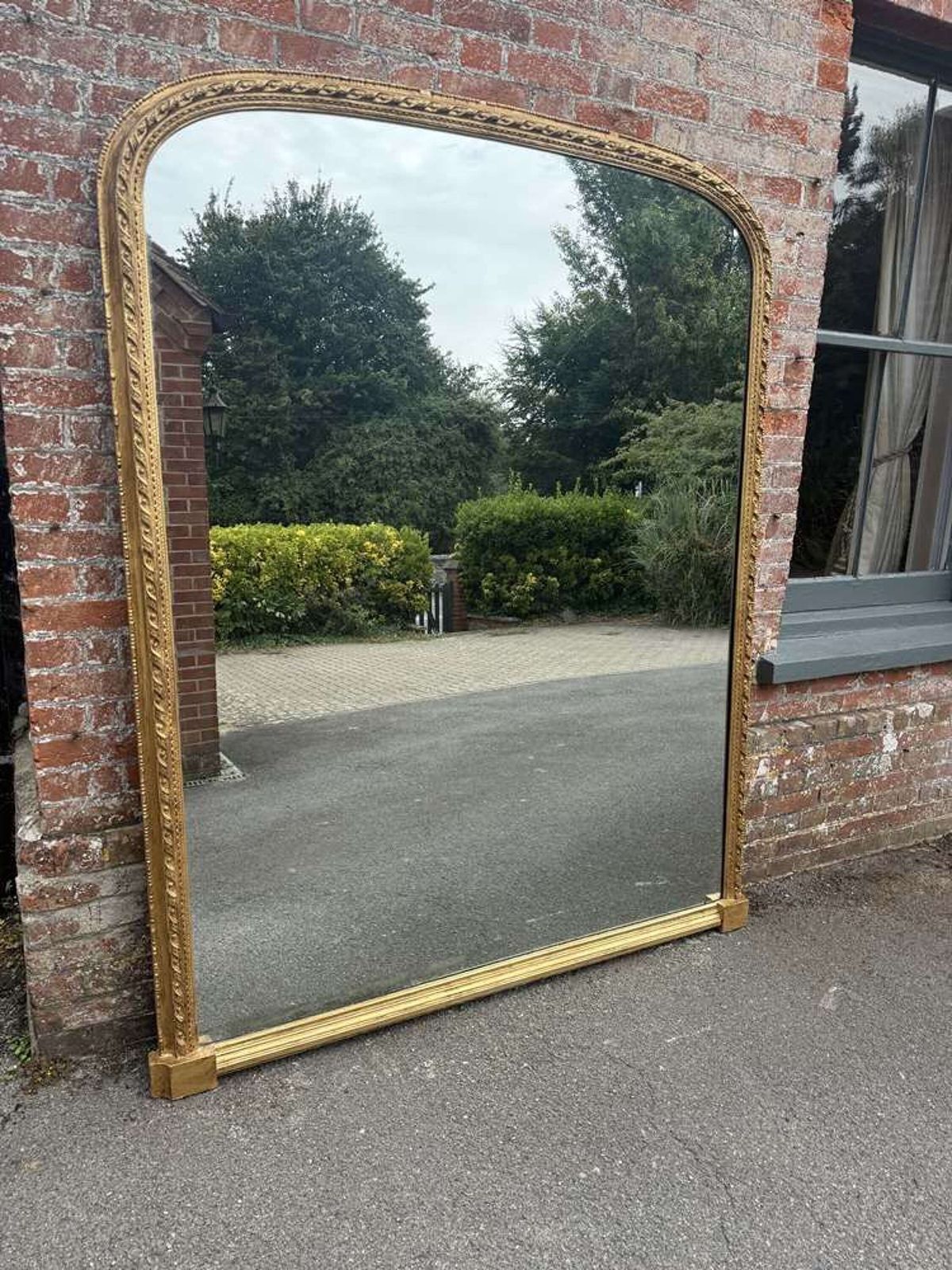 A Spectacular Extra Large Antique English 19th C Arched Top Gilt Overmantle Mirror.