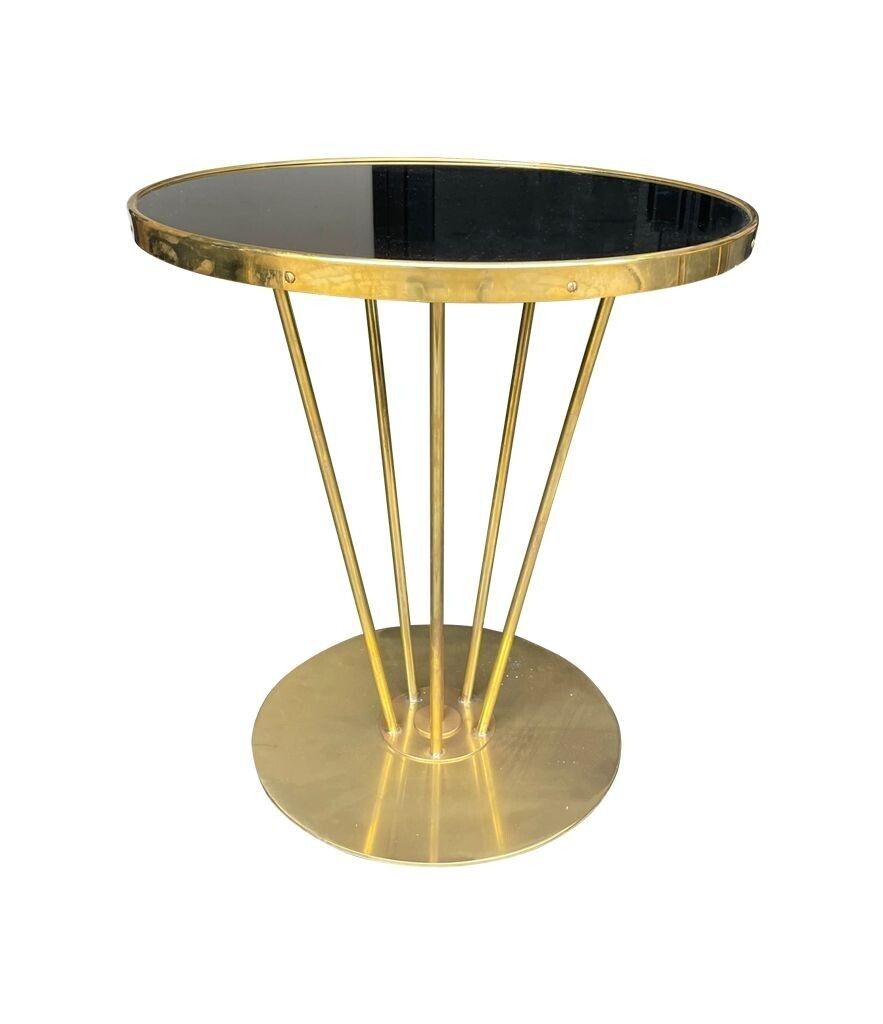 An Italian Brass And Black Glass Circular Side Tables