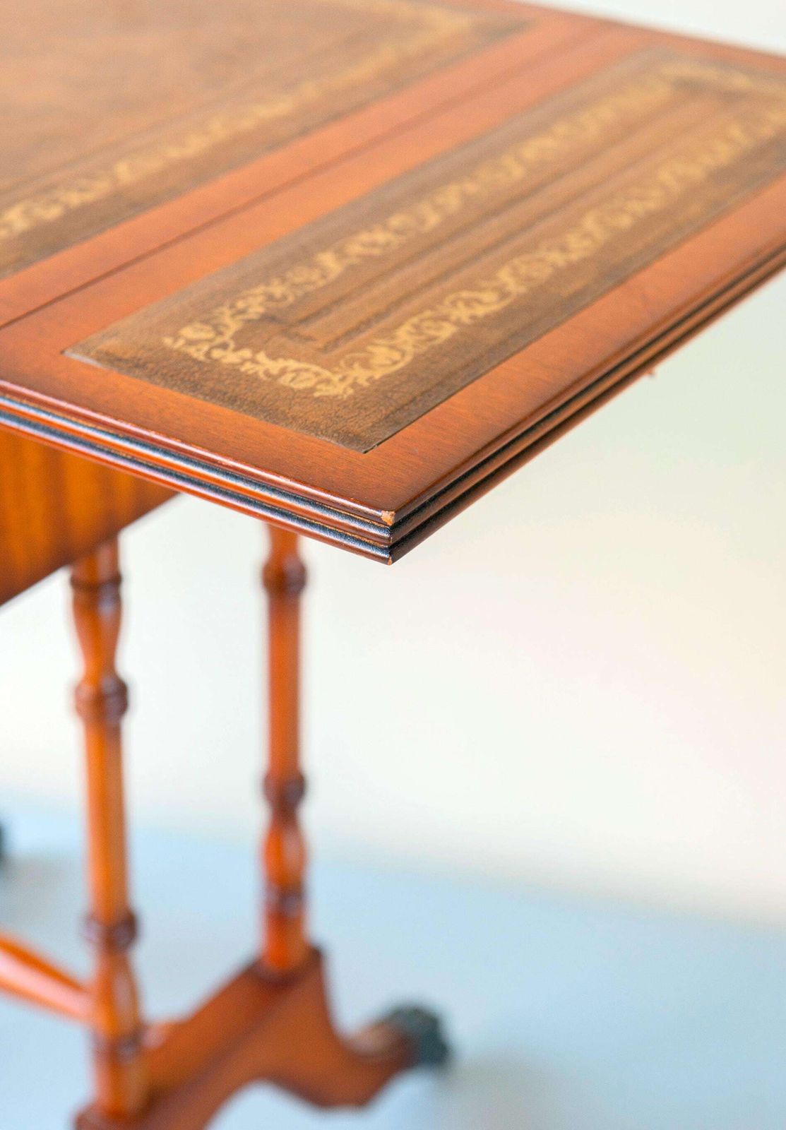 photo vintage English Mahogany Pembroke Table – Victorian Style Drop Leaf Side Table   Leather Inlay, Turned Legs, Drawer, And Claw Casters
