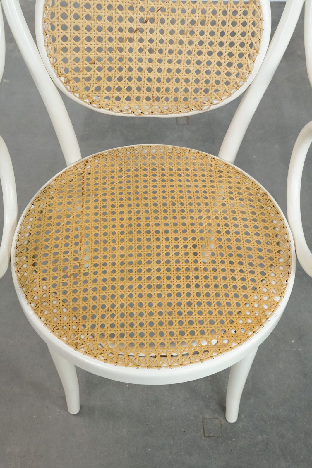 Vintage White Bistro Chair With Armrests In Thonet Style With A Graceful Curved Wooden Frame, Webbing Seat And Backrest photo vinterior