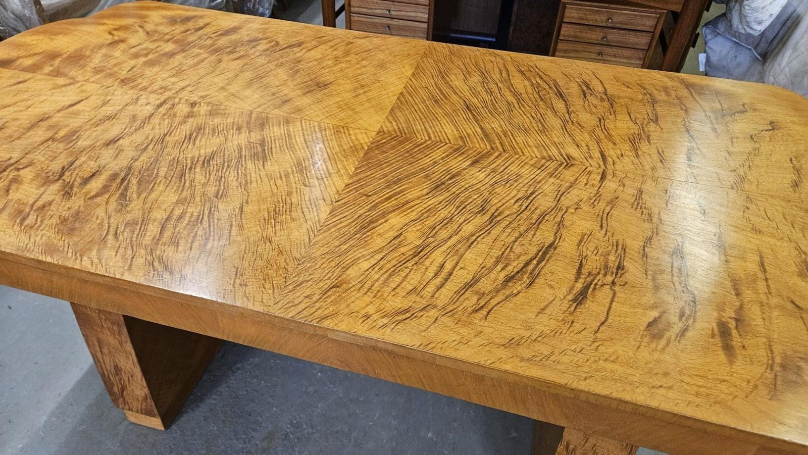 photo for sale Art Deco Dining Table With Cloud Shape Ends And Tiger Wood Grain Finish