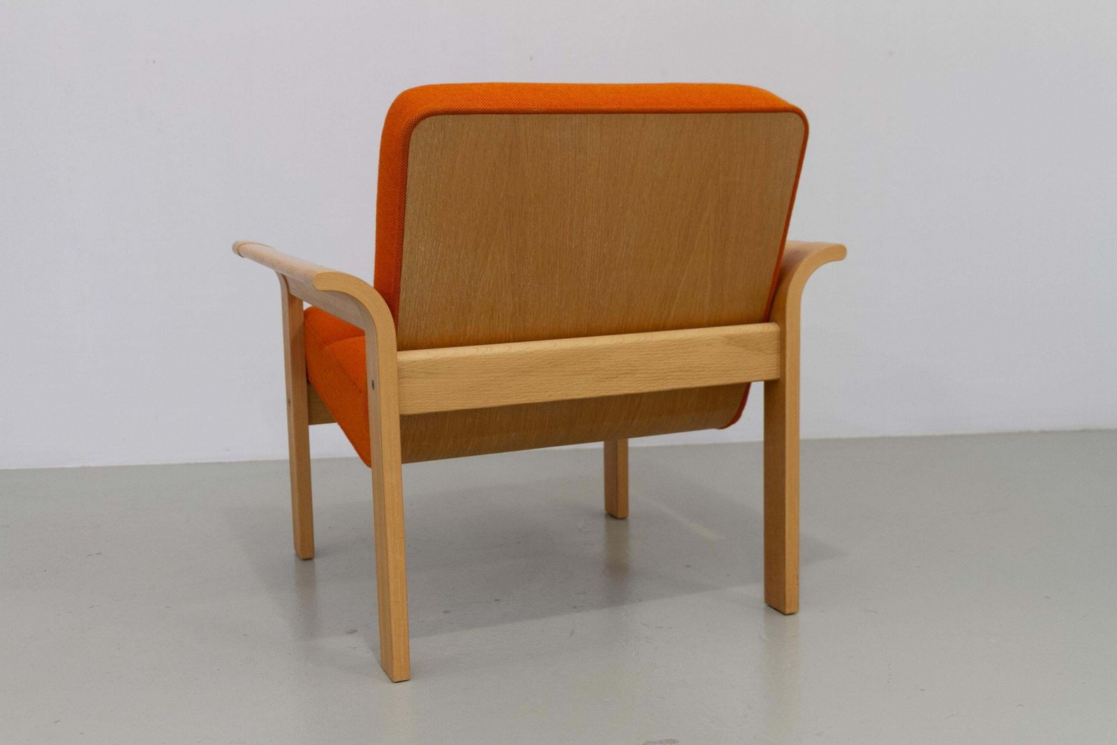 photo for sale Danish Orange Oak Botium Lounge Chair By Magnus Olesen, 1970s.