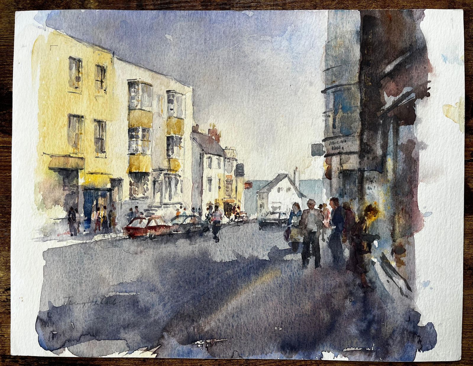 Anthony Herbertbusy High Street Scene With Figures Cars And Yellow Townhouses Watercolour photo furniture