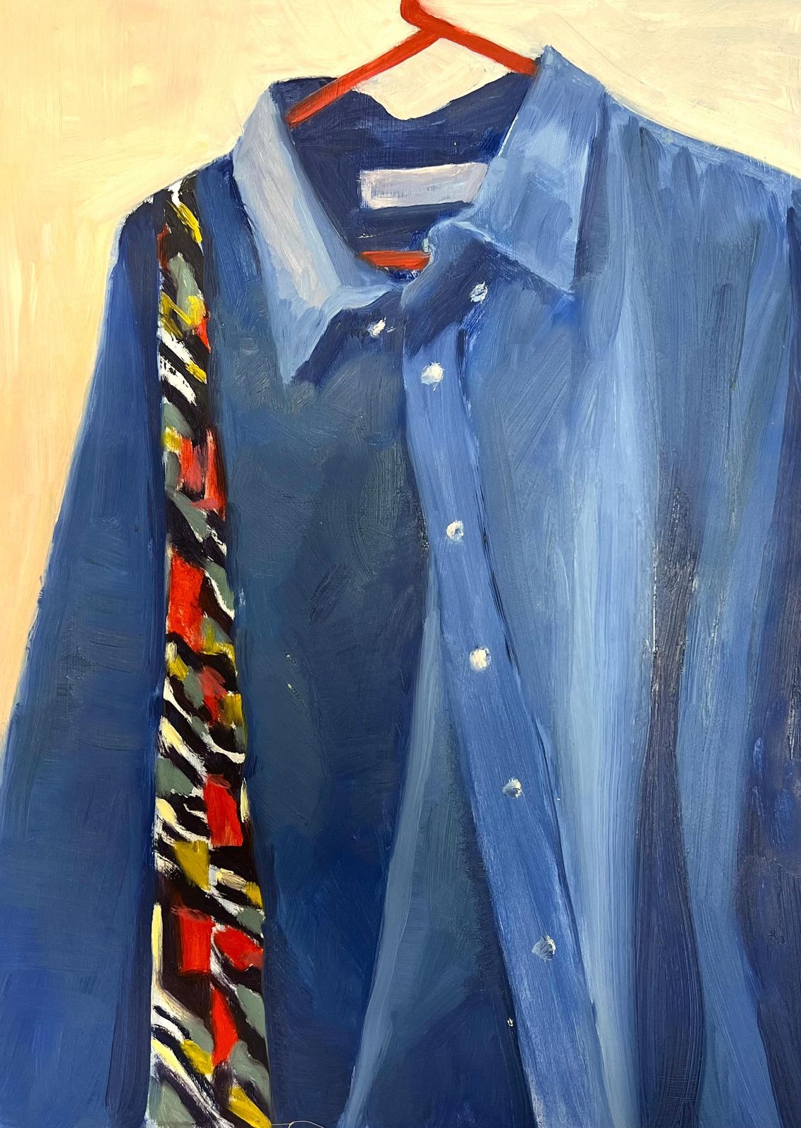 Jill Jacksonblue Denim Shirt Hanging On A Red Hanger With A Boldly Patterned Scarf photo for sale