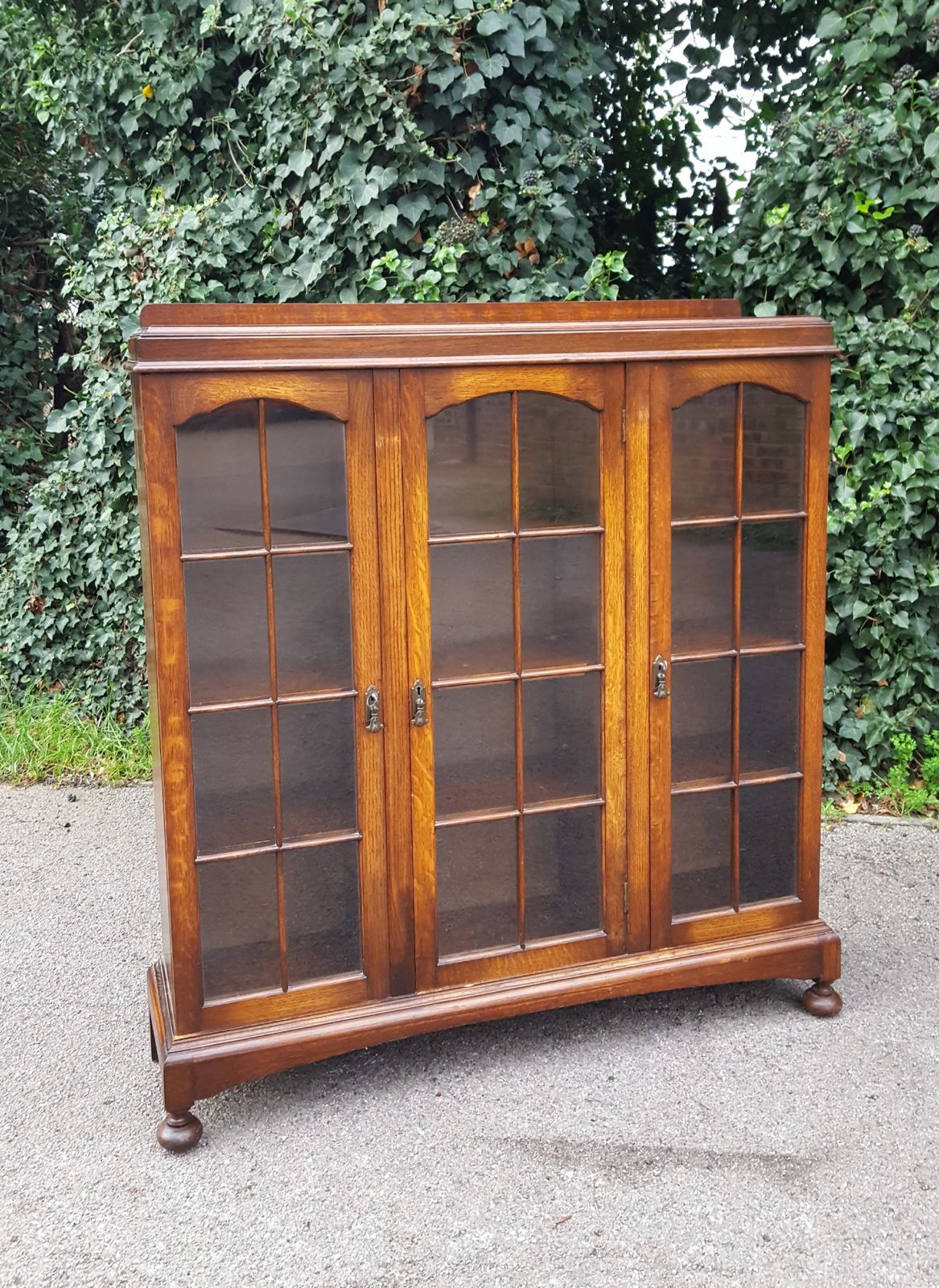 Pair Of Heals 3 Door Oak Bookcases photo for sale