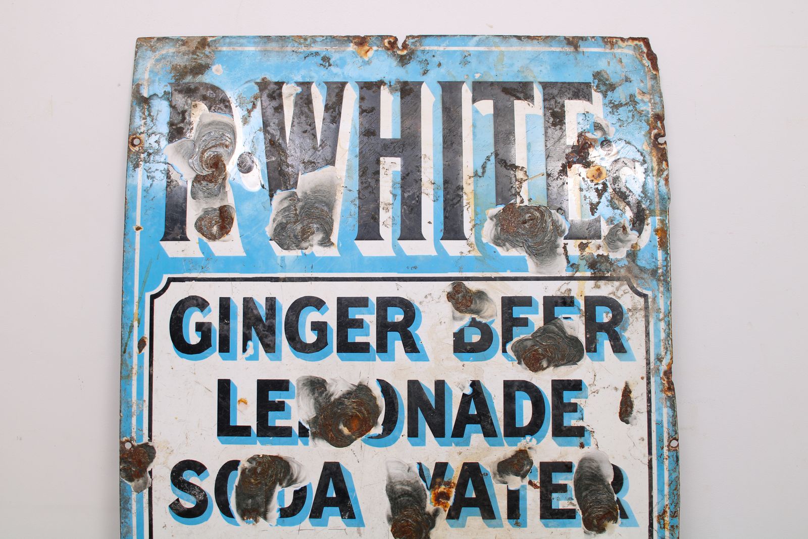 A Vintage Mid Century R.Whites Enamel Drinks Advertising Sign photo furniture