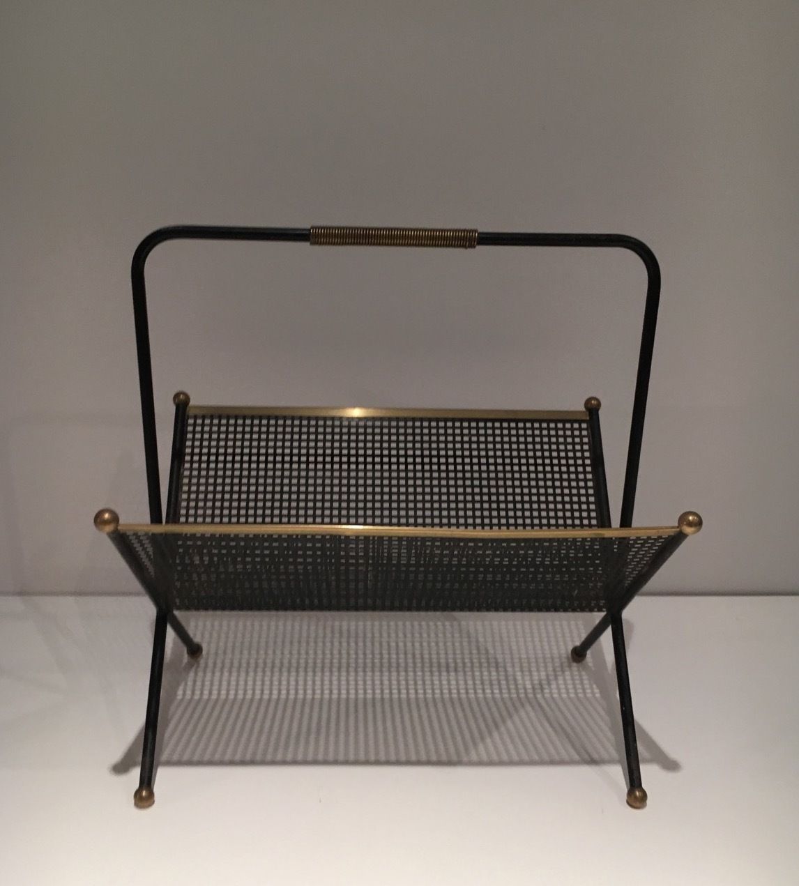 Design Magazine Rack In Black Lacquered Metal, Perforated Sheet Metal And Brass photo furniture
