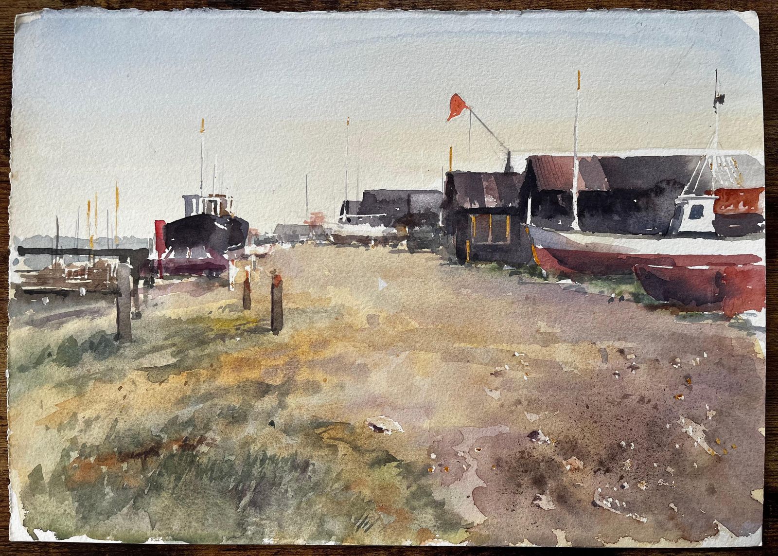 Anthony Herbert Coastal Boatyard With Fishing Huts Beached Boats And Red Flag Watercolour Scene photo furniture