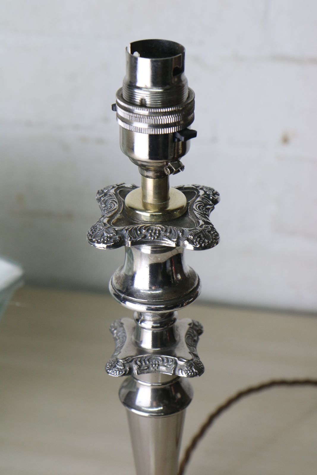 A Vintage Silver Plated Table Lamp With Ornate Castings With A Pale Sage Pinch Pleated Lampshade photo vintage