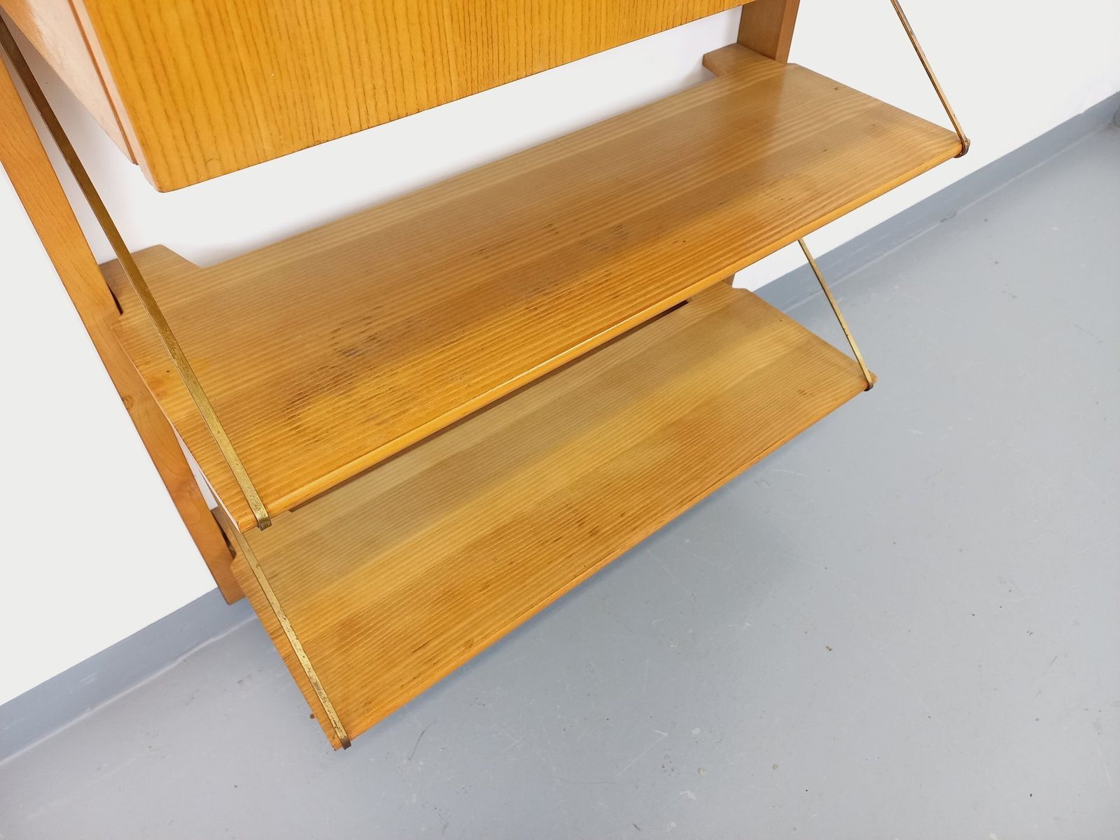 photo furniture Wall Mounted Bookcase With Secretary Desk, Made Of Wood And Brass